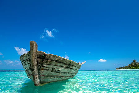 boat floating on a tropical sea