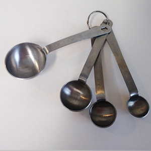 Measuring spoons for measuring ingredients wet and dry